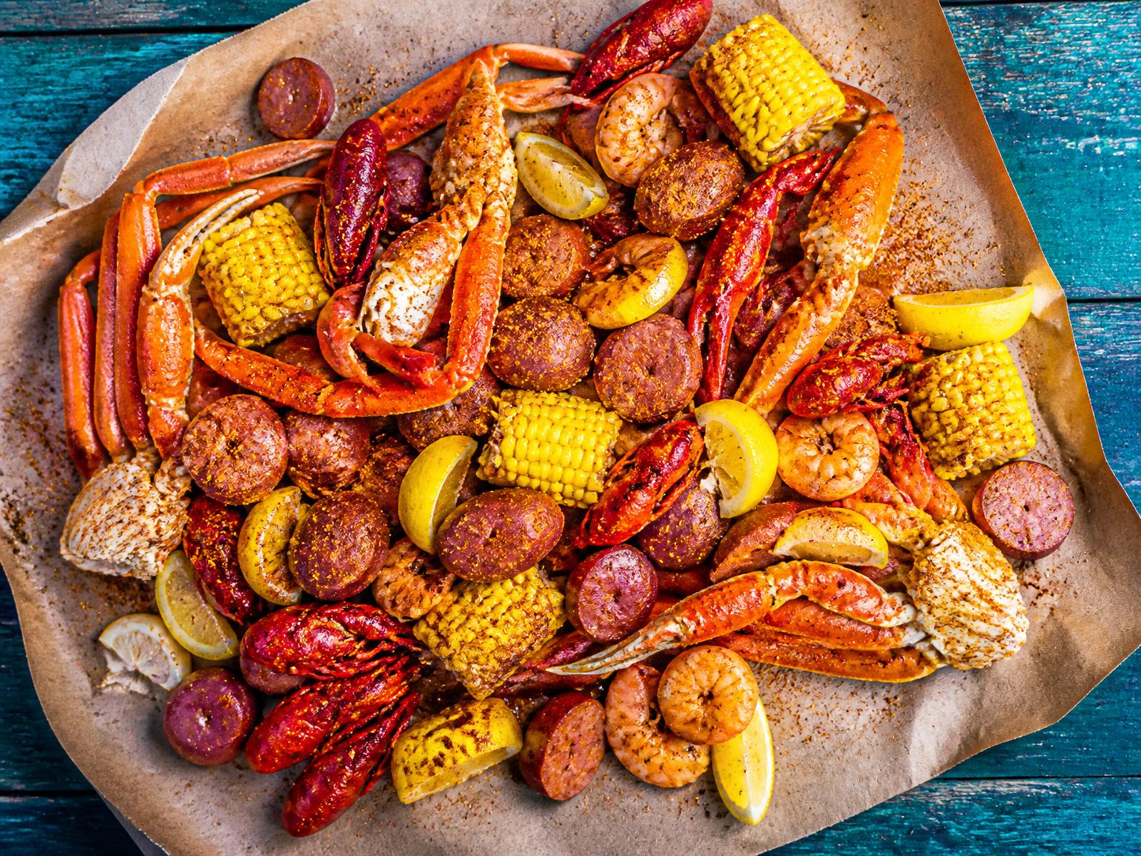 Cajun seafood boil piled with crab, shrimp, corn and sausage